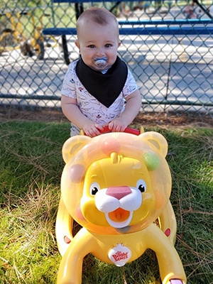 Infant playing outside