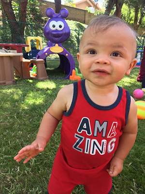 Infant playing outside